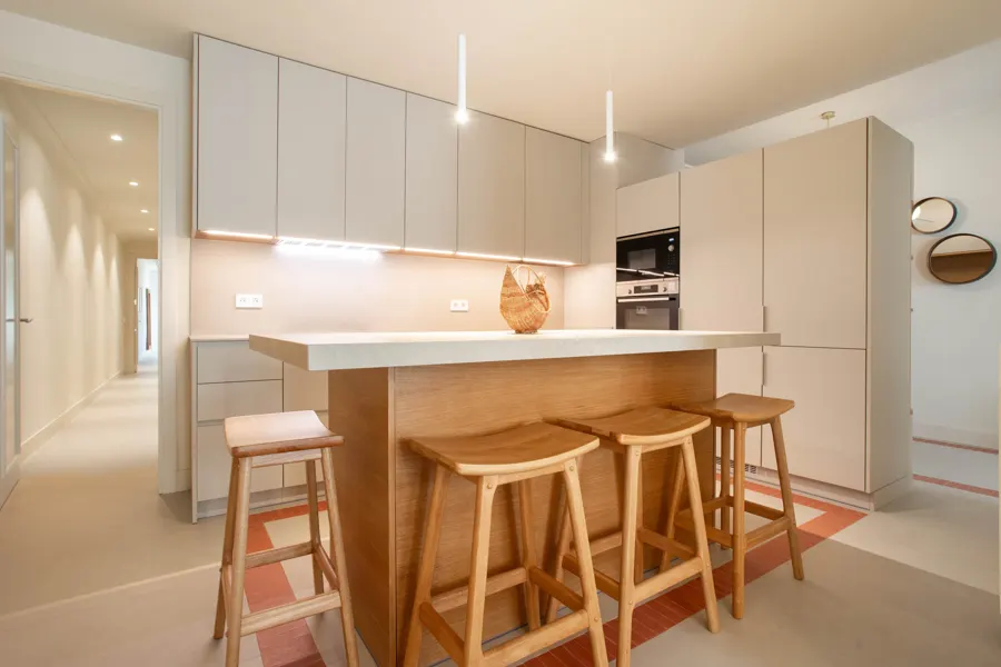 Kitchen with oak island and bar stools